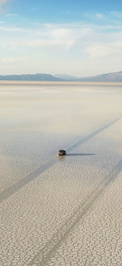Driving across Uyuni Salt Flats in Bolivia