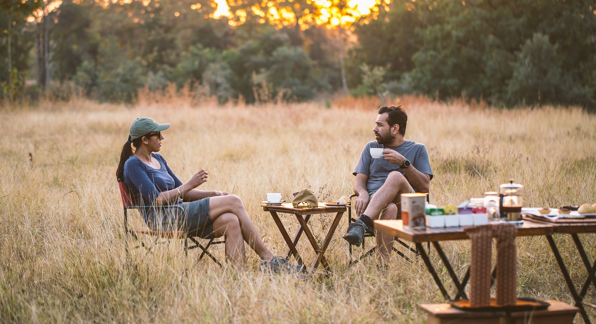 couple taking sundowners on their tiger safari in India