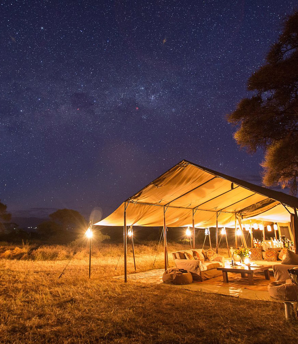 mess tent of a private mobile camp in Tanzania at night