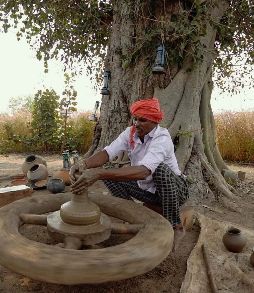 local man doing pottery at Haldu tola villa