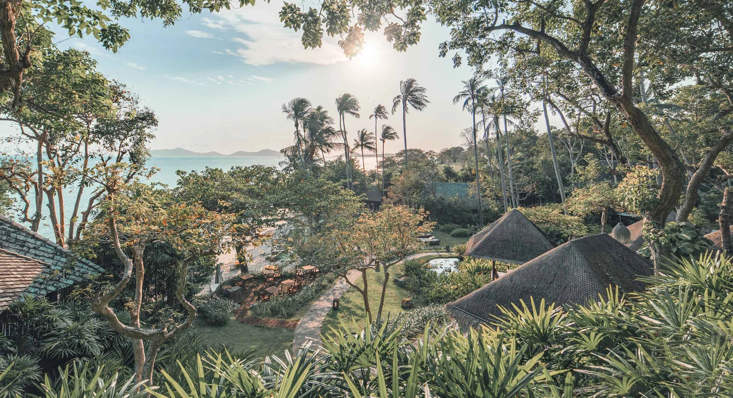 View of landscape surrounding Kamalaya wellness retreat with roofs of suites