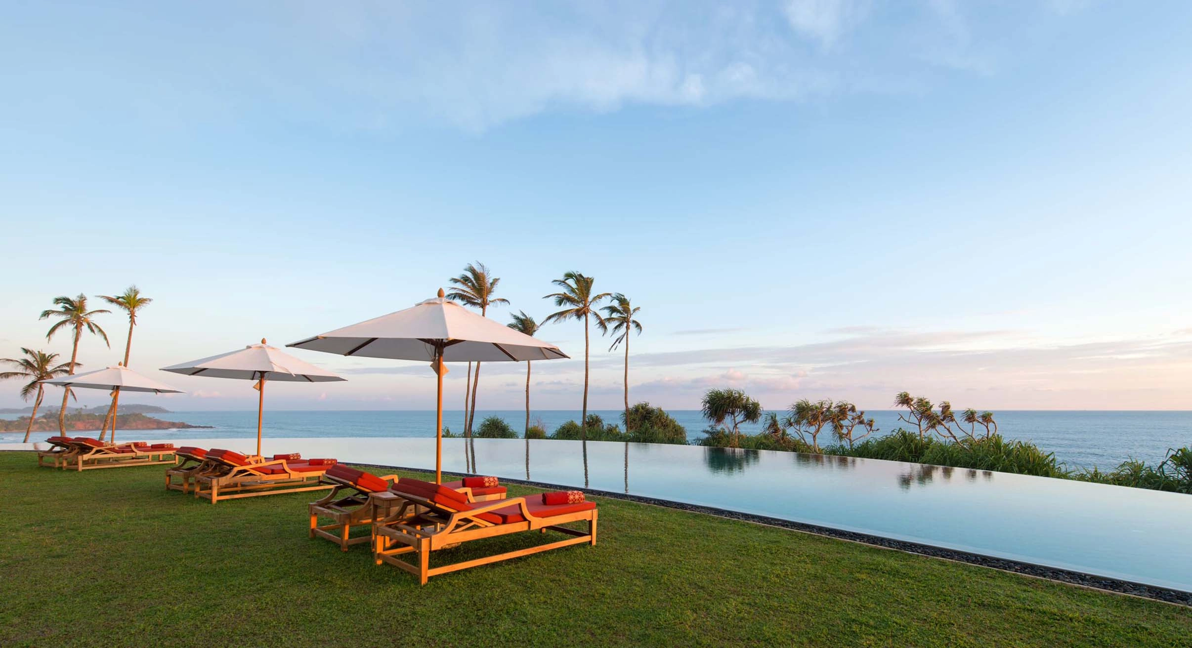 View of pool and ocean in distance at Cape Weligama in Sri Lanka