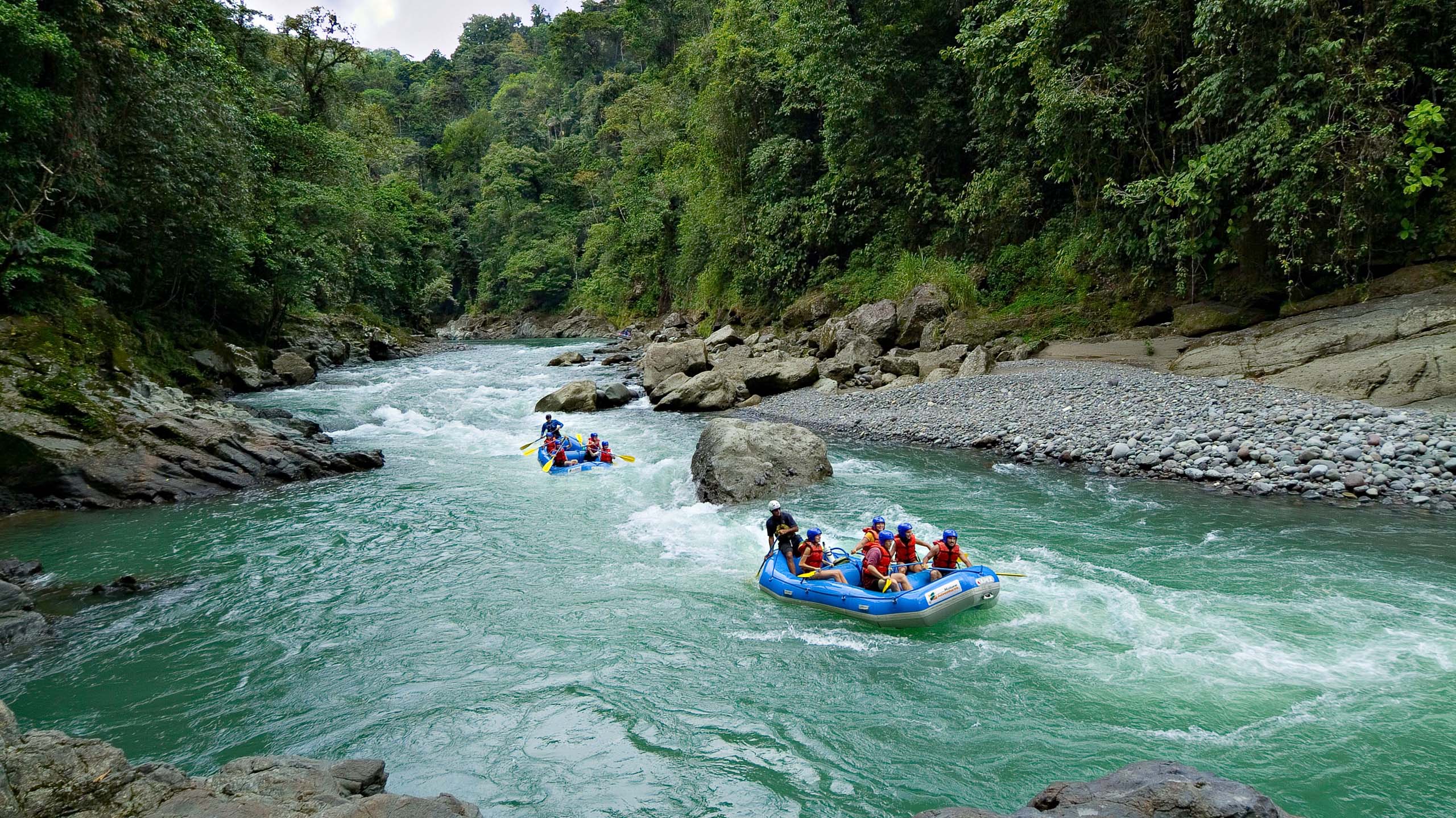 two rafting boats on the pacuare river in costa rica